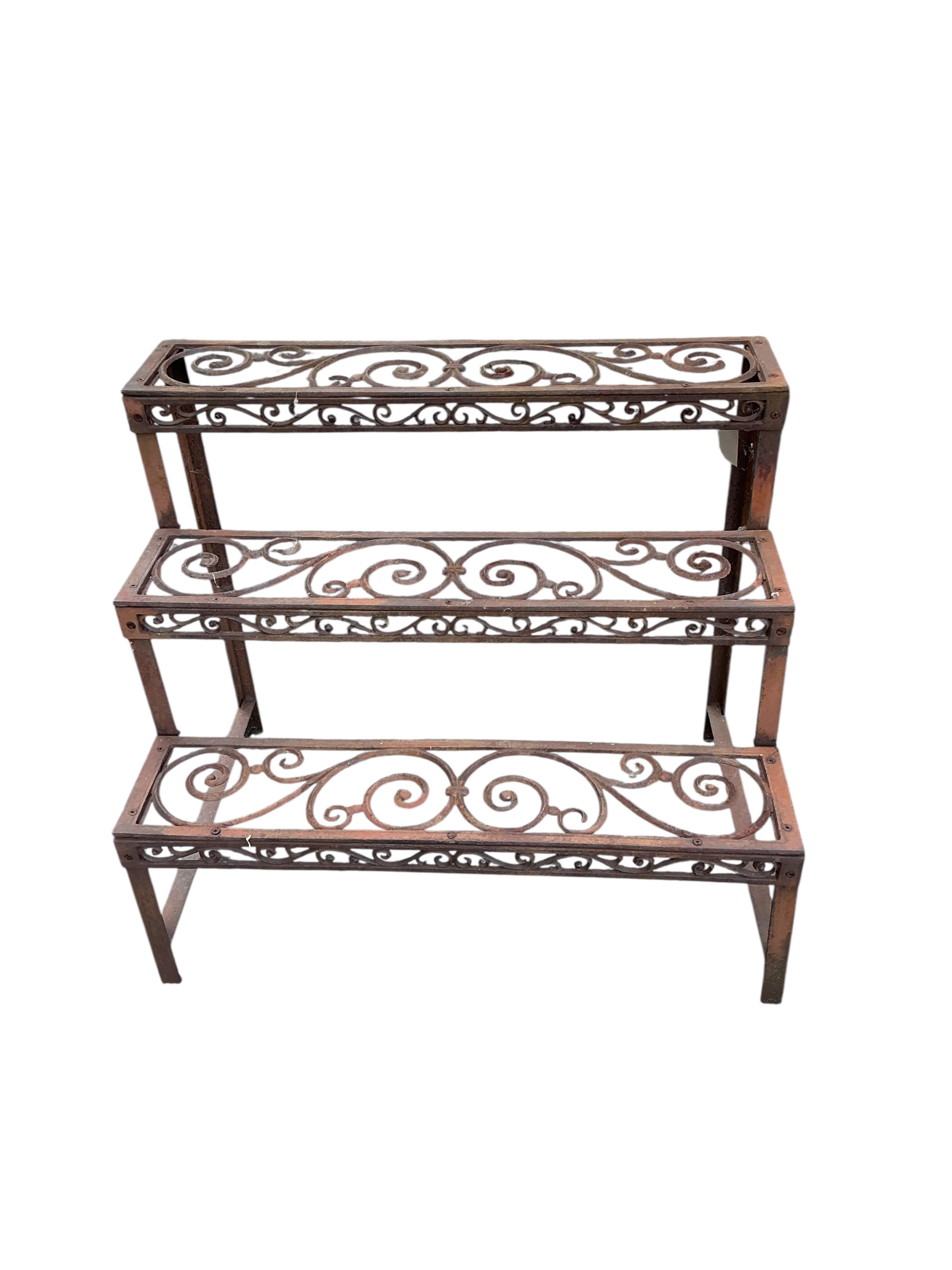 Two Victorian style cast metal pot stands, larger width 76cm, height 65cm